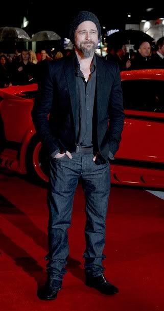 Scruffy in black Actor Brad Pitt arrives