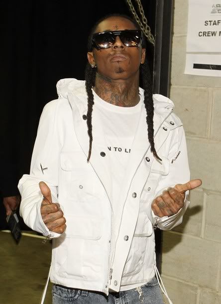 Lil Wayne kicks it back stage.