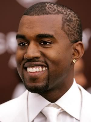 Kanye West with artistic swirls cut into his hair.